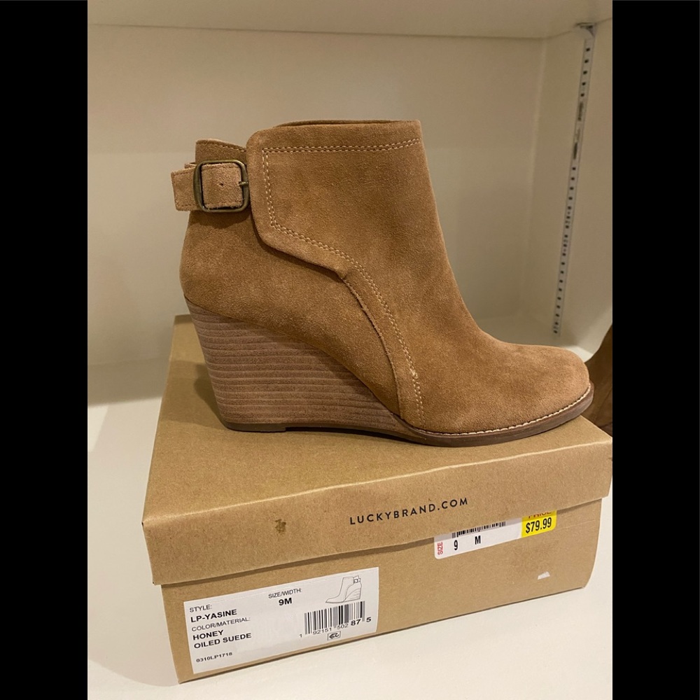 Lucky Brand tan suede booties size 9. The wedge heel 3.5 inches. Never worn.